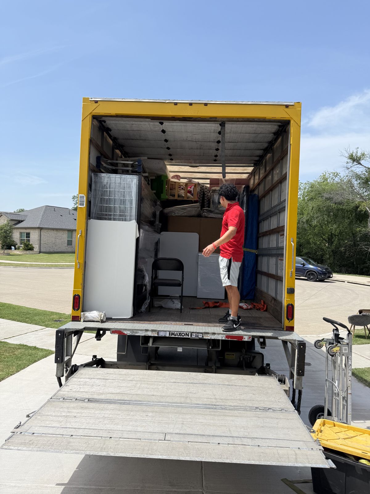 TL Moving truck in a Dallas neighborhood